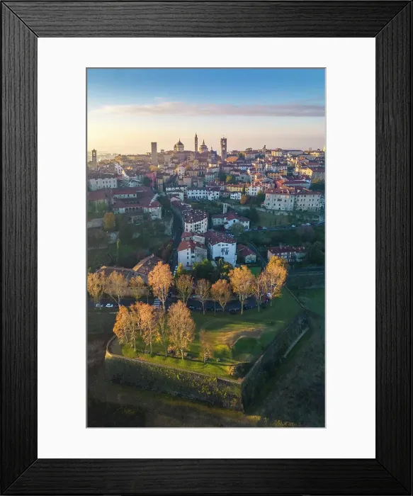 Framed Print : View of the rooftops, churches and towers of the Upper Town (Città Alta) of Bergamo city at sunrise. Bergamo, Lombardy, Italy Framed Print : View of the rooftops, churches and towers of the Upper Town (Città Alta) of Bergamo city at sunrise. Bergamo, Lombardy, Italy
