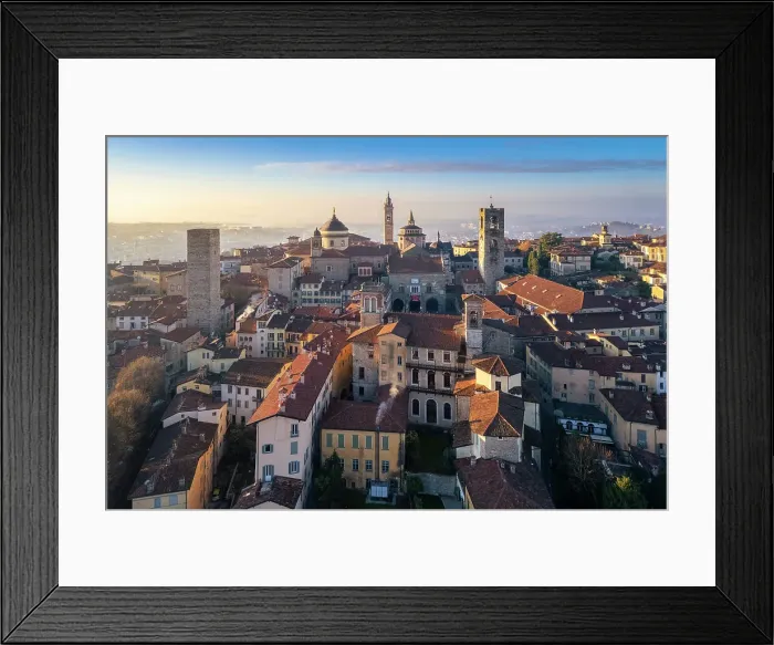 Framed Print : View of the rooftops, churches and towers of the Upper Town (Citt√† Alta) of Bergamo city at sunrise. Bergamo, Lombardy, Italy