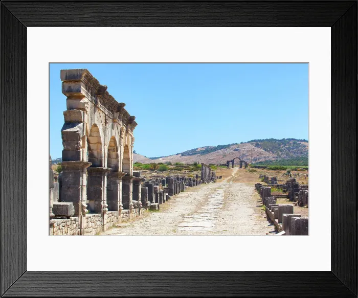 Framed Print : The main road (Decumanus Maximus) of the ancient Roman ruins of Volubilis, near Meknes, Morocco Framed Print : The main road (Decumanus Maximus) of the ancient Roman ruins of Volubilis, near Meknes, Morocco