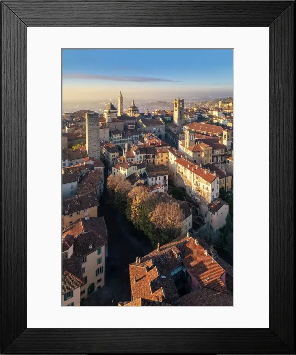 Framed Print : View of the rooftops, churches and towers of the Upper Town (Citt√† Alta) of Bergamo city at sunrise. Bergamo, Lombardy, Italy