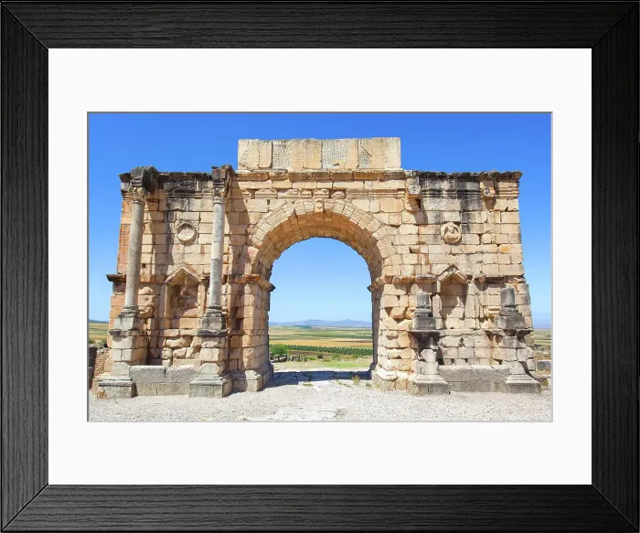 Framed Print : The Arch of Caracalla (Triumphal Arch) in the ancient Roman ruins of Volubilis, near Meknes, Morocco Framed Print : The Arch of Caracalla (Triumphal Arch) in the ancient Roman ruins of Volubilis, near Meknes, Morocco