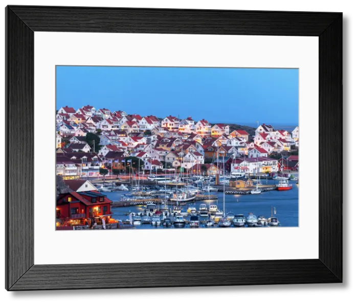 Framed Print : Illuminated houses in Kungshamn village and the marina, dusk time, Sotenas municipality, Vastra Gotaland, West Sweden, Sweden