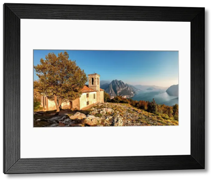 Framed Print : Church of Santuario della Santissima Trinità at the top of a mountain dominating Lake Iseo at sunset. Iseo Lake, Bergamo district, Lombardy, Italy Framed Print : Church of Santuario della Santissima Trinità at the top of a mountain dominating Lake Iseo at sunset. Iseo Lake, Bergamo district, Lombardy, Italy