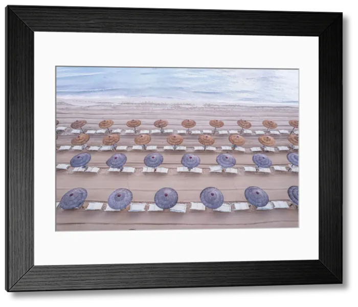 Framed Print : Aerial view of tidy beach umbrella seen from above, Mediterranean Sea, South of Sicily, Sicily, Italy