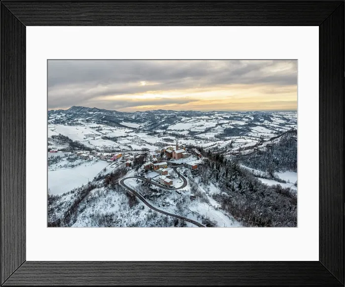 Framed Print : Winter aerial view of the town of Casasco in the Alessandria hills. Alessandria province, Piedmont, Italy Framed Print : Winter aerial view of the town of Casasco in the Alessandria hills. Alessandria province, Piedmont, Italy