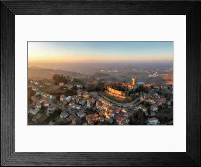 Framed Print : Aerial view of the town of Cigognola and its castle. Cigognola, Oltrepo wine region, Oltrepo pavese, Lombardy, Italy