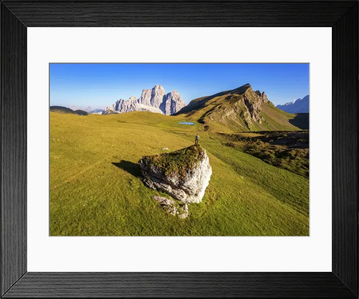 Framed Print : Hiker with backpack admiring Mount Pelmo and Baste lake, Mondeval flat, Giua pass, Cadore valley, Cortina d'Ampezzo, Dolomites, Veneto, Italy (MR)