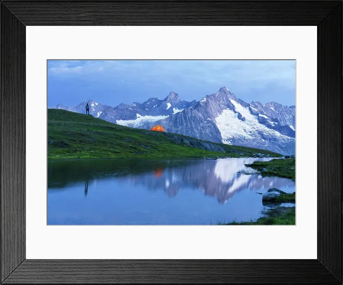 Framed Print : Man with tent on top of the hill admires the alpine landscape of the Mount Blanc by the lake at dawn, Fenetre lakes, Ferret valley, Valais canton, Switzerland (MR) Framed Print : Man with tent on top of the hill admires the alpine landscape of the Mount Blanc by the lake at dawn, Fenetre lakes, Ferret valley, Valais canton, Switzerland (MR)