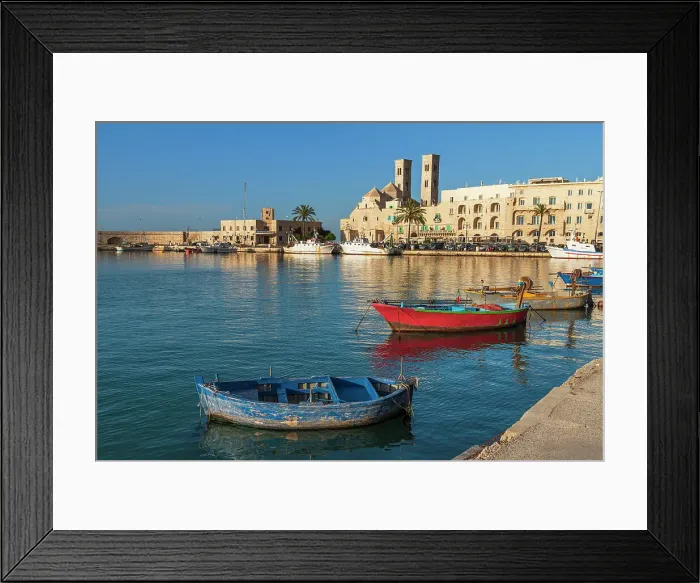 Framed Print : Small fishing boats in the harbour of Molfetta old town with the church in the background, Apulia, Italy Framed Print : Small fishing boats in the harbour of Molfetta old town with the church in the background, Apulia, Italy