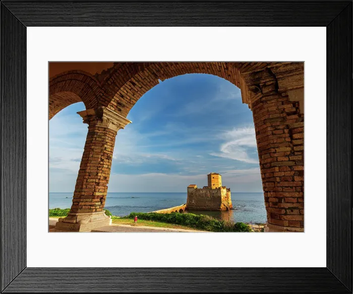 Framed Print : Man in green field admires the medieval castle of Torre Astura at sunset, Nettuno municipality, Rome province, Latium, Tyrrhenian sea, Italy (MR) Framed Print : Man in green field admires the medieval castle of Torre Astura at sunset, Nettuno municipality, Rome province, Latium, Tyrrhenian sea, Italy (MR)