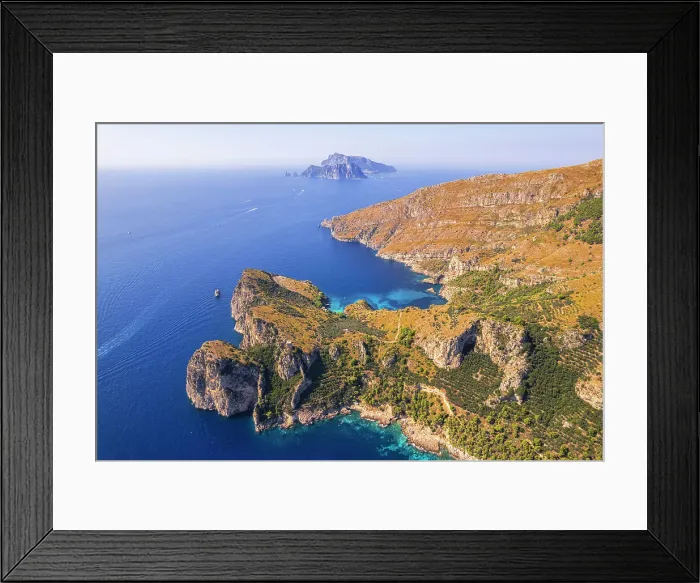Framed Print : Punta Campanella and Amalfi coast with Capri island in the background, Punta Campanella, Ieranto bay, Nerano, Amalfi coast, Naples province, Campania, Italy