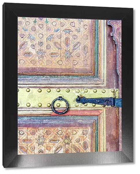 Decorated ancient wooden doorway, Bahia Palace, Marrakech, Morocco