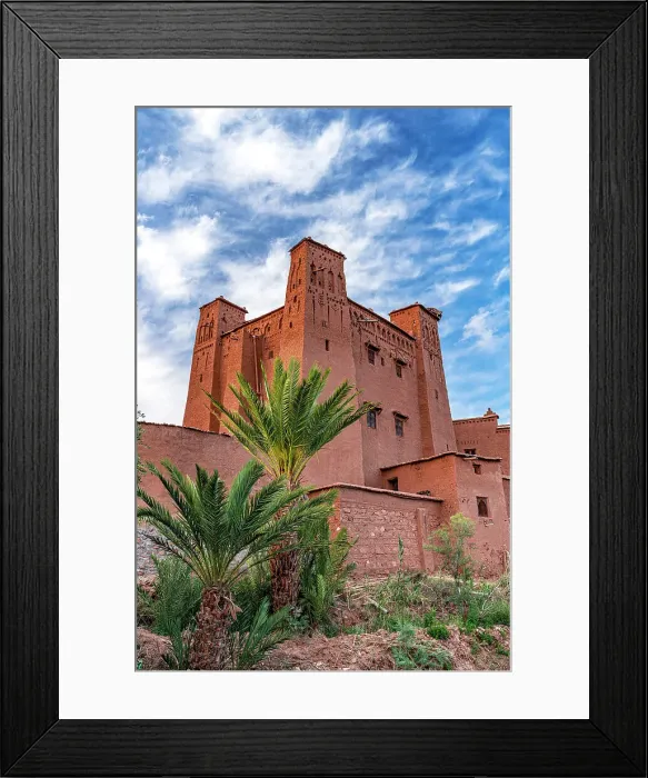 Framed Print : Palm trees framing the historic red mudbricks buildings in Ait Ben Haddou ksar, Ouarzazate province, Morocco Framed Print : Palm trees framing the historic red mudbricks buildings in Ait Ben Haddou ksar, Ouarzazate province, Morocco