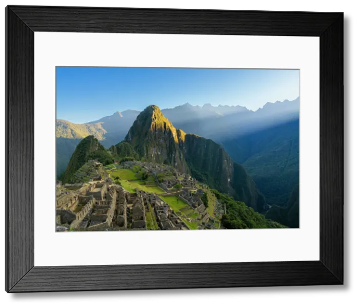 Framed Print : Historic ancient archeological Incan Machu Picchu on mountain in Andes at sunrise, Cuzco Region, Peru Framed Print : Historic ancient archeological Incan Machu Picchu on mountain in Andes at sunrise, Cuzco Region, Peru