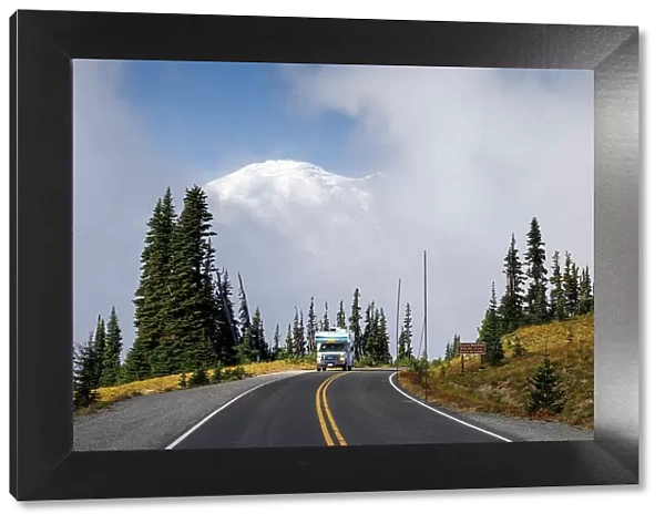 RV on road with Mount Rainier beyond, Sunrise, Mount Rainier National Park, Washington, USA