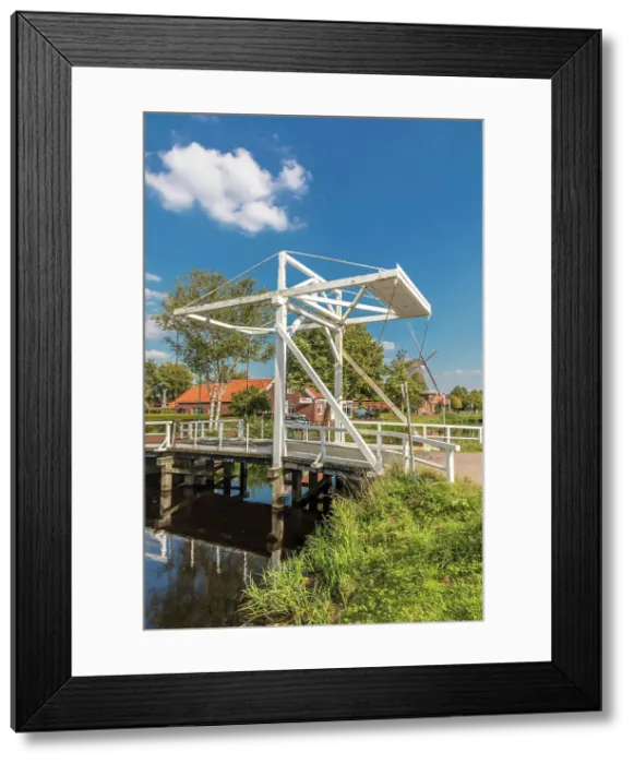 Framed Print : Bascule bridge in OstGrossefehn over the Fehn Canal, Grossefehn, East Frisia, Lower Saxony, Germany Framed Print : Bascule bridge in OstGrossefehn over the Fehn Canal, Grossefehn, East Frisia, Lower Saxony, Germany