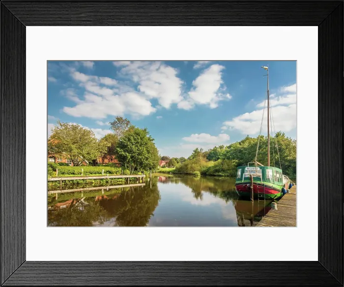Framed Print : Typical canal boat on the Fehntjer Tief canal, Grossefehn, East Frisia, Lower Saxony, Germany