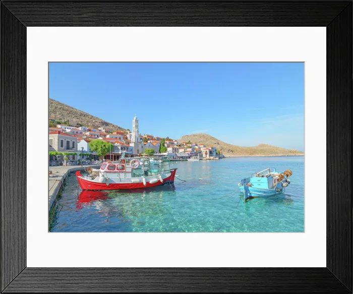Framed Print : View of Emporio harbour and Saint Nicholas church in the distance, Halki Island, Dodecanese Islands, Greece Framed Print : View of Emporio harbour and Saint Nicholas church in the distance, Halki Island, Dodecanese Islands, Greece