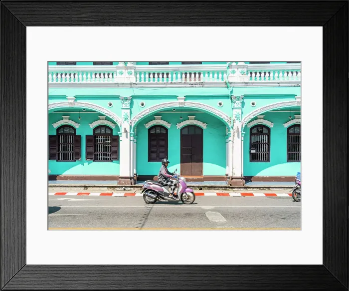 Framed Print : Scooter riding past beautiful buildings in the Old town, Phuket, Thailand Framed Print : Scooter riding past beautiful buildings in the Old town, Phuket, Thailand