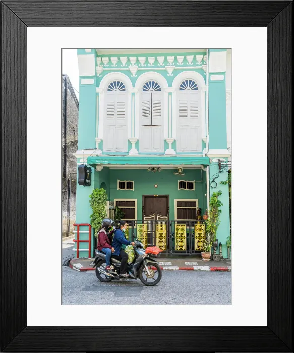 Framed Print : Scooter riding past beautiful buildings in the Old town, Phuket, Thailand Framed Print : Scooter riding past beautiful buildings in the Old town, Phuket, Thailand
