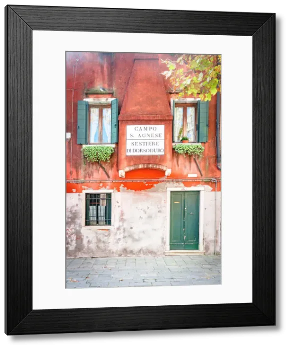 Framed Print : Painted facade of traditional house in an old alley of Venice, Veneto, Italy Framed Print : Painted facade of traditional house in an old alley of Venice, Veneto, Italy
