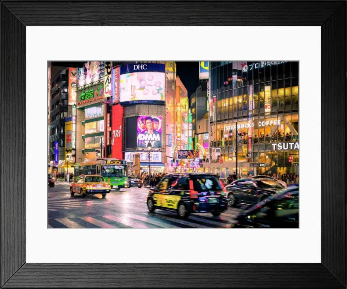 Framed Print : Summer nightlife in Shibuya Tokyo, with taxis, illuminated signs and people crowding streets and cafè Framed Print : Summer nightlife in Shibuya Tokyo, with taxis, illuminated signs and people crowding streets and cafè