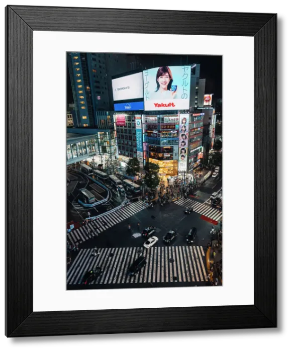 Framed Print : Typical view of Tokyo Shibuya crossing from above. Pedestrian crossing full of people walking in a summer night, Japan Framed Print : Typical view of Tokyo Shibuya crossing from above. Pedestrian crossing full of people walking in a summer night, Japan