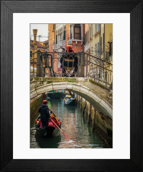 Framed Print : Gondolier rowing a gondola in a canal, Venice, Veneto, Italy Framed Print : Gondolier rowing a gondola in a canal, Venice, Veneto, Italy