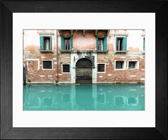 Framed Print : An old facade reflected in a canal, Venice, Italy