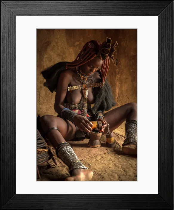Framed Print : Africa, Namibia, Kamanjab. A himba woman preparing the smoke to deodorize herself Framed Print : Africa, Namibia, Kamanjab. A himba woman preparing the smoke to deodorize herself