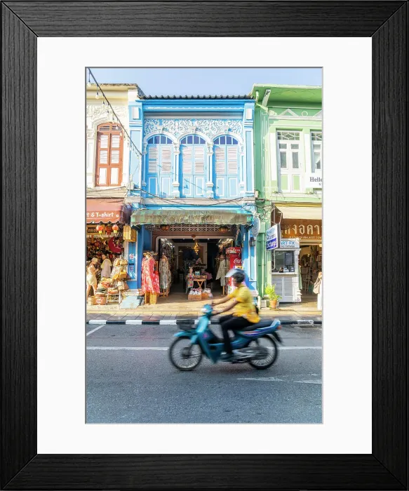 Framed Print : Scooter riding past beautiful buildings in the Old town, Phuket, Thailand Framed Print : Scooter riding past beautiful buildings in the Old town, Phuket, Thailand