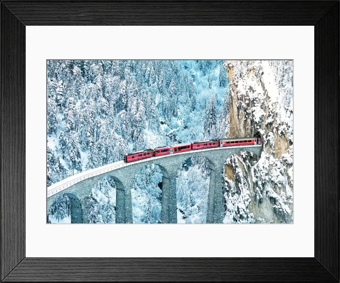 Framed Print : Train on Landwasser viaduct entering in a tunnel carved into a mountain ridge in winter, Filisur, Graubunden canton, Switzerland Framed Print : Train on Landwasser viaduct entering in a tunnel carved into a mountain ridge in winter, Filisur, Graubunden canton, Switzerland