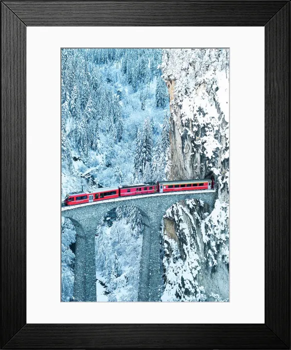 Framed Print : Swiss red train running on Landwasser viaduct from a tunnel carved on steep mountain, Filisur, Graubunden canton, Switzerland Framed Print : Swiss red train running on Landwasser viaduct from a tunnel carved on steep mountain, Filisur, Graubunden canton, Switzerland