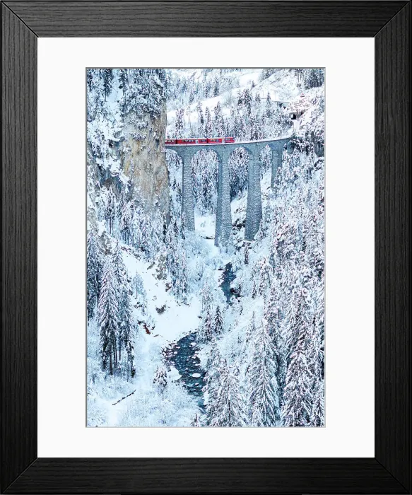 Framed Print : Red train on famous Landwasser viaduct in the frozen snowy woods in winter, Filisur, Graubunden canton, Switzerland Framed Print : Red train on famous Landwasser viaduct in the frozen snowy woods in winter, Filisur, Graubunden canton, Switzerland