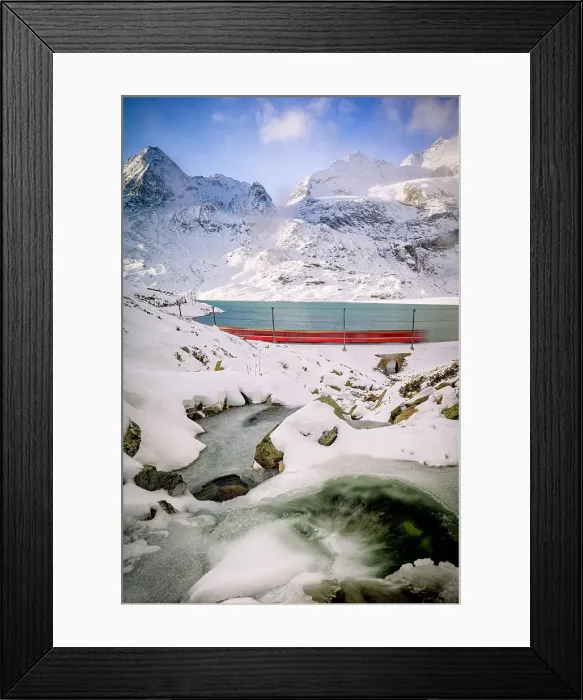 Framed Print : Bernina train running fast in the frozen snowy landscape nearby Lago Bianco lake, Bernina Pass, Graubunden, Engadin, Switzerland Framed Print : Bernina train running fast in the frozen snowy landscape nearby Lago Bianco lake, Bernina Pass, Graubunden, Engadin, Switzerland