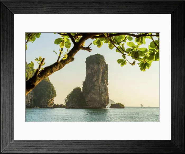Framed Print : Limestone Karst tower framed by trees on Pai Plong Beach, Ao Nang, Krabi, Thailand Framed Print : Limestone Karst tower framed by trees on Pai Plong Beach, Ao Nang, Krabi, Thailand