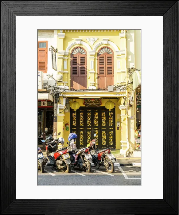 Framed Print : Scooter riding past beautiful buildings in the Old town, Phuket, Thailand Framed Print : Scooter riding past beautiful buildings in the Old town, Phuket, Thailand