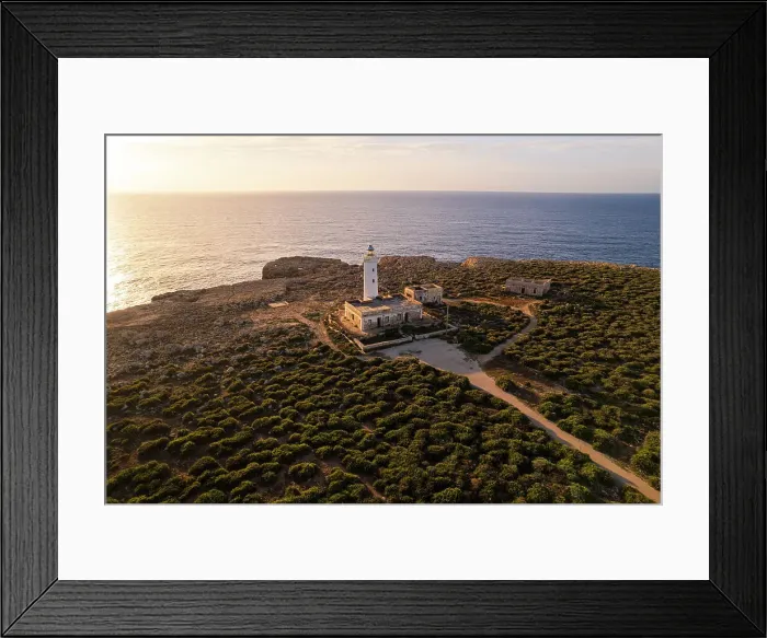Framed Print : Drone view of the lighthouse Capo Murro di Porco standing on top of a cliff surrounded by Ionian sea at sunrise, Plemmirio marine park, Syracuse, Sicily, Italy Framed Print : Drone view of the lighthouse Capo Murro di Porco standing on top of a cliff surrounded by Ionian sea at sunrise, Plemmirio marine park, Syracuse, Sicily, Italy
