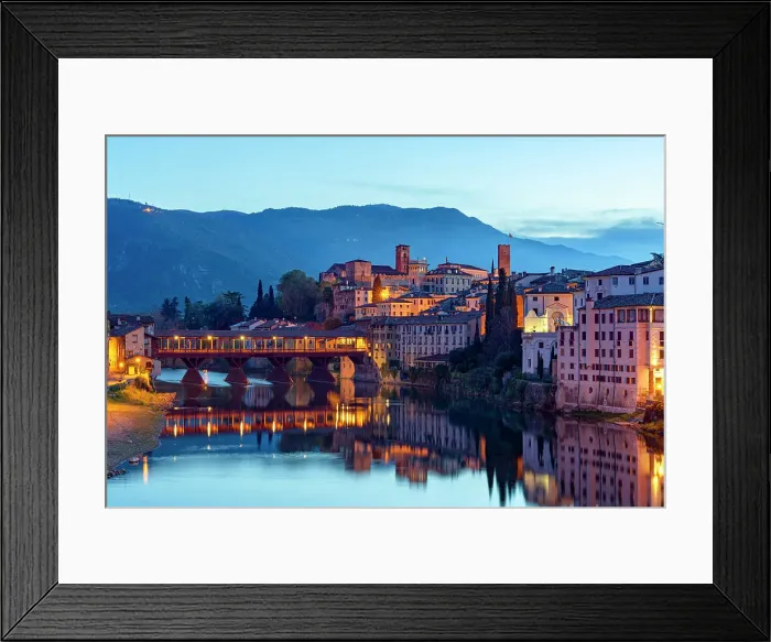 Framed Print : Dusk over the iconic Ponte Vecchio bridge reflected in river Brenta, Bassano Del Grappa, Vicenza province, Veneto, Italy Framed Print : Dusk over the iconic Ponte Vecchio bridge reflected in river Brenta, Bassano Del Grappa, Vicenza province, Veneto, Italy