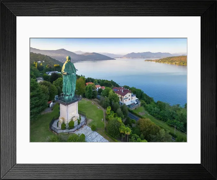 Framed Print : Aerial view of the Statue of San Carlo Borromeo during a summer sunset. Arona, Lake Maggiore, Piedmont, Italy Framed Print : Aerial view of the Statue of San Carlo Borromeo during a summer sunset. Arona, Lake Maggiore, Piedmont, Italy