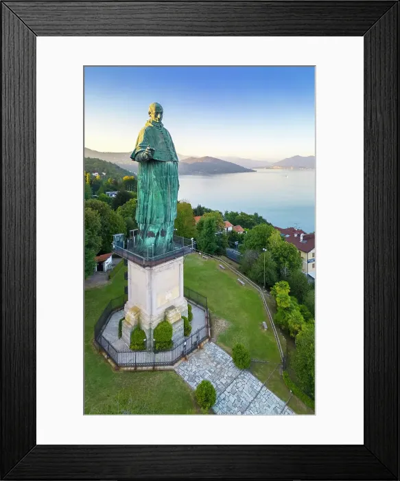 Framed Print : Aerial view of the Statue of San Carlo Borromeo during a summer sunset. Arona, Lake Maggiore, Piedmont, Italy Framed Print : Aerial view of the Statue of San Carlo Borromeo during a summer sunset. Arona, Lake Maggiore, Piedmont, Italy