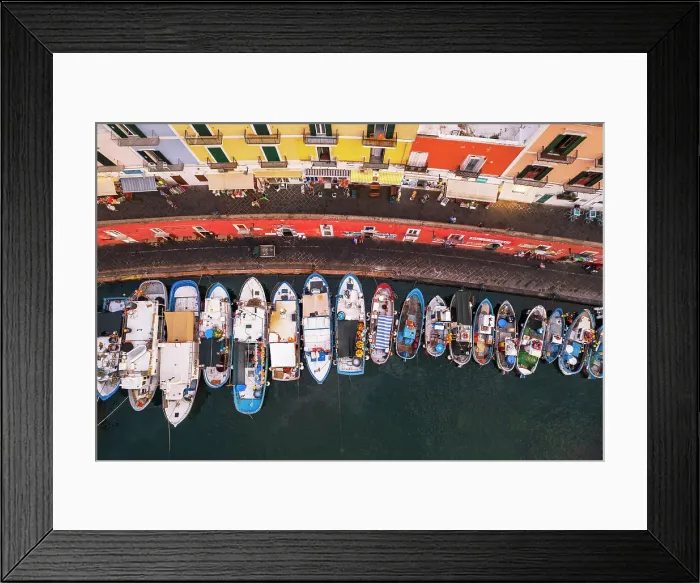 Framed Print : Aerial view of the harbour of Ponza with colorful facades and fishing vessels, Ponza island, Pontine islands, Latium, Italy Framed Print : Aerial view of the harbour of Ponza with colorful facades and fishing vessels, Ponza island, Pontine islands, Latium, Italy