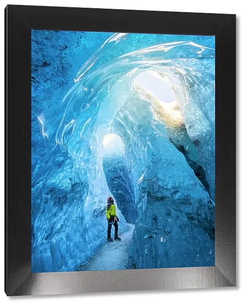 Man in an ice cave of Breidamerkurjokull, Austurland, Iceland(MR)