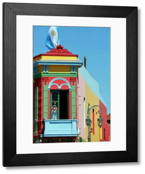Framed Print : The figure of Lionel Messi holding the World Cup on a balcony of the Caminito de la Boca, Buenos Aires, Argentina Framed Print : The figure of Lionel Messi holding the World Cup on a balcony of the Caminito de la Boca, Buenos Aires, Argentina