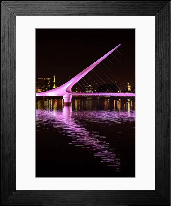 Framed Print : The Puente de la Mujer bridge at night, Puerto Madero, Buenos Aires, Argentina. It was designed by architect Santiago Calatrava Framed Print : The Puente de la Mujer bridge at night, Puerto Madero, Buenos Aires, Argentina. It was designed by architect Santiago Calatrava