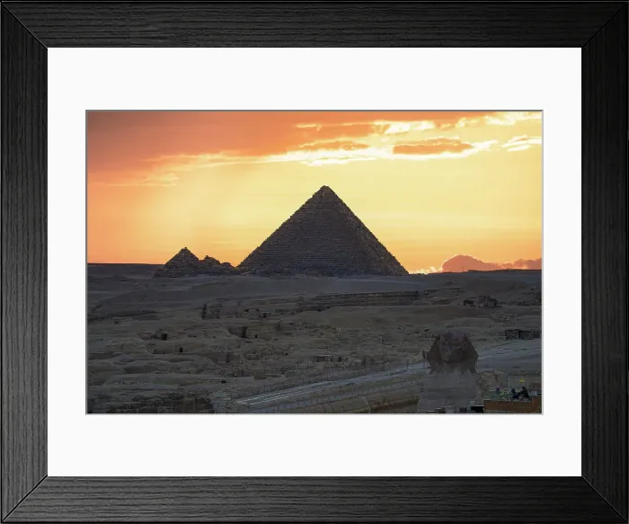 Framed Print : Silhouette of Giza pyramids and The Sphinx under a fiery sky at sunset, Cairo, Egypt Framed Print : Silhouette of Giza pyramids and The Sphinx under a fiery sky at sunset, Cairo, Egypt