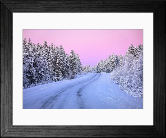Framed Print : Pink arctic sunset over an empty frozen road in the middle of a snowy forest in winter, Iso Syote, Lapland, Finland Framed Print : Pink arctic sunset over an empty frozen road in the middle of a snowy forest in winter, Iso Syote, Lapland, Finland