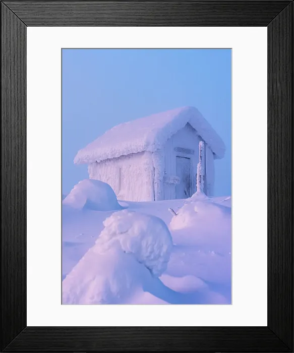 Framed Print : Mountain hut covered with snow surrounded by ice sculptures in the cold winter landscape of Finnish Lapland at dawn Framed Print : Mountain hut covered with snow surrounded by ice sculptures in the cold winter landscape of Finnish Lapland at dawn