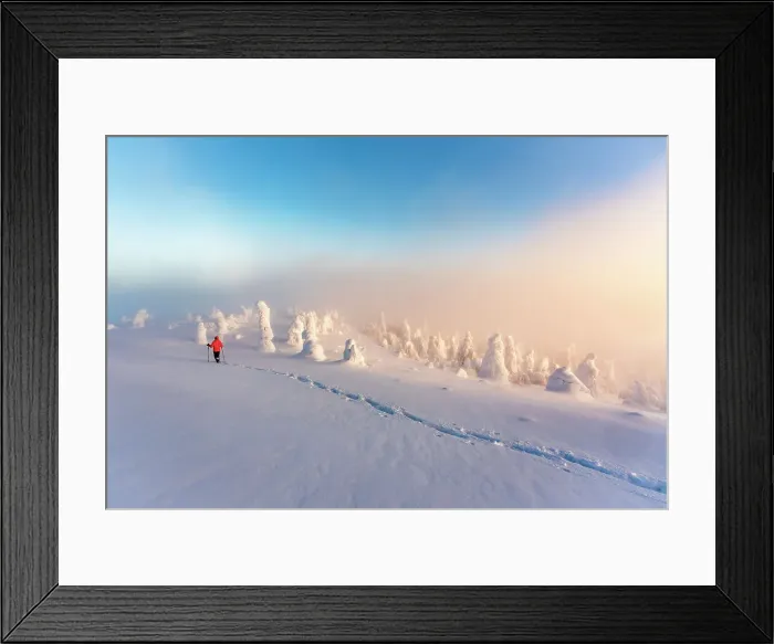 Framed Print : Hiker snowshoeing in deep snow in the winter scenery of Finnish Lapland at dawn Framed Print : Hiker snowshoeing in deep snow in the winter scenery of Finnish Lapland at dawn