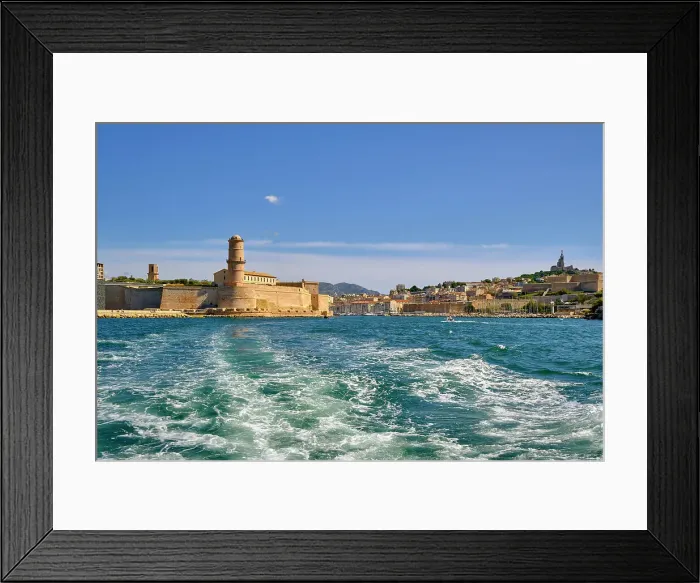 Framed Print : The entrance to the Old Port (Vieux Port) of Marseille. On the mountain in the right side we can see Notre-Dame de la Garde. On the left side we can see Fort Saint Jean. France Framed Print : The entrance to the Old Port (Vieux Port) of Marseille. On the mountain in the right side we can see Notre-Dame de la Garde. On the left side we can see Fort Saint Jean. France